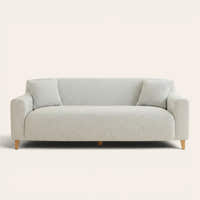 Silver grey knit sofa cover fitted on a three-seater, front view on ivory backdrop