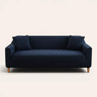 Midnight navy quilted sofa cover fitted on a three-seat couch with matching cushions, front view on ivory.