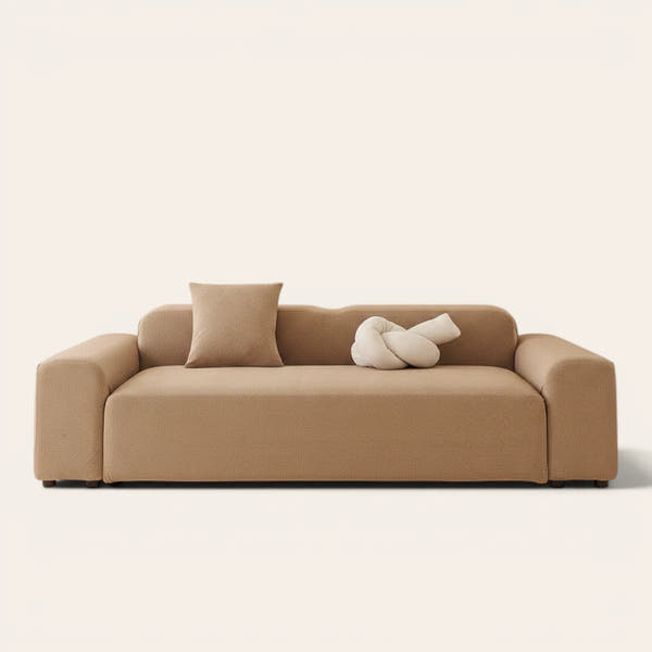 Caramel sand smooth microfibre sofa cover fitted on a three-seat couch, front view on ivory.