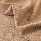 Close-up of the caramel sand smooth microfibre texture draped in a soft diagonal fold.