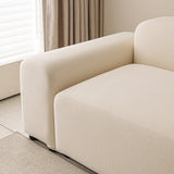 Corner of the cream smooth sofa cover by a window with soft daylight