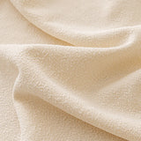Macro of the fine soft-touch texture of the cream sofa cover