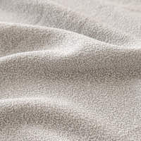 Macro of the fine soft-touch texture of the silver grey sofa cover