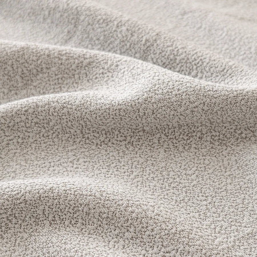 Macro of the fine soft-touch texture of the silver grey sofa cover