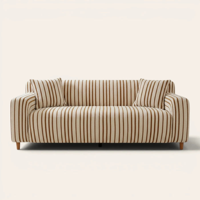 Caramel brown striped sofa cover on a three-seat sofa with matching cushions, front view on ivory