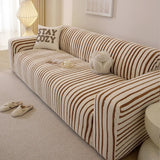Caramel brown striped sofa cover wrapping the corner and armrest in a sunlit living room