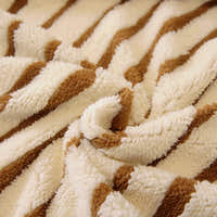 Macro of the plush caramel brown and ivory striped sofa cover fabric texture