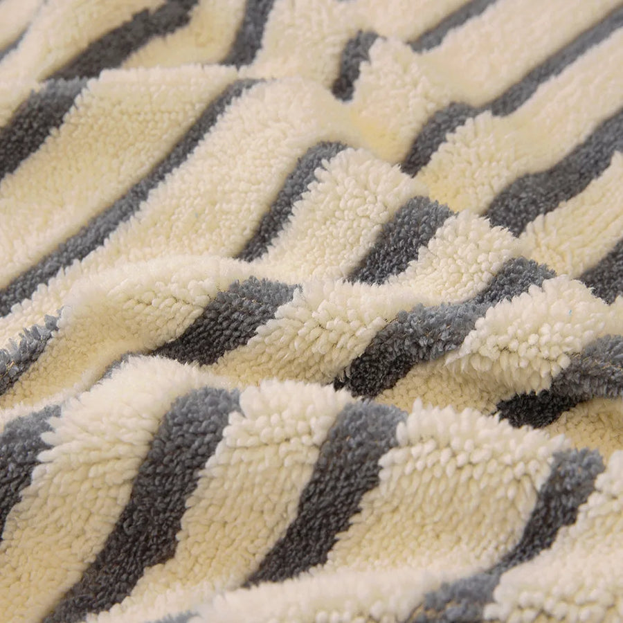 Macro of the plush ocean blue and ivory striped sofa cover fabric texture