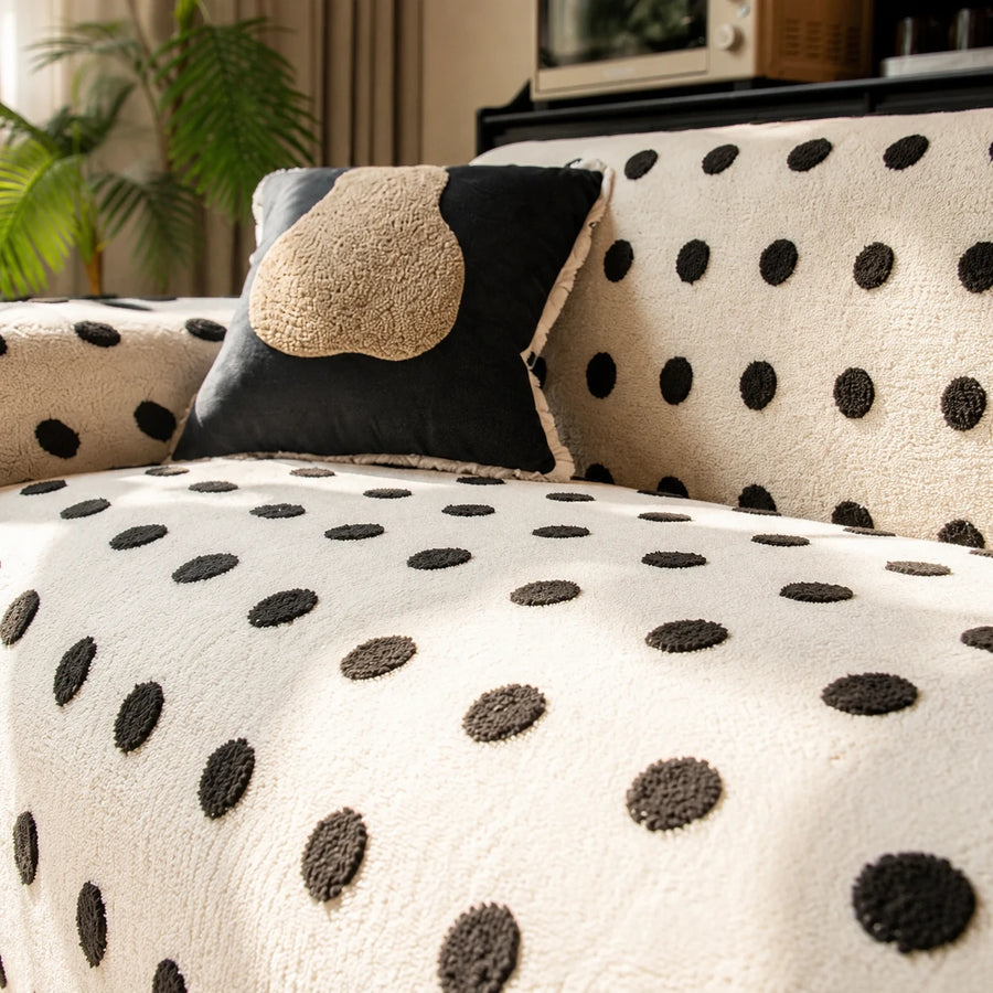 Close view of the cream black teddy sofa cover backrest with a dark accent cushion