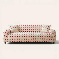 Cream red teddy sofa cover with red polka dots on a three-seat sofa, front view on ivory backdrop
