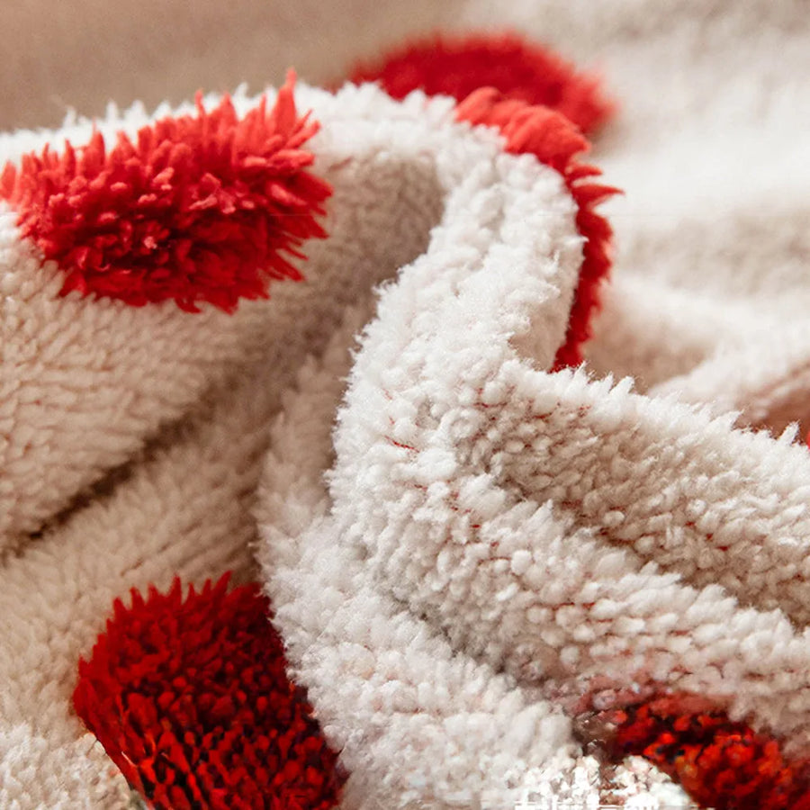 Macro close-up of the cream teddy sherpa with raised tufted red dots