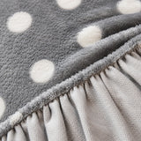 Detail of the elastic gathered hem on the grey snow teddy sofa cover underside
