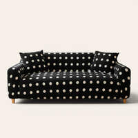 Midnight dot teddy sofa cover with cream polka dots on a three-seat sofa, front view on ivory backdrop