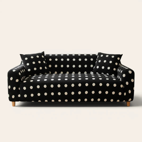 Midnight dot teddy sofa cover with cream polka dots on a three-seat sofa, front view on ivory backdrop
