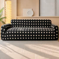 Midnight dot teddy sofa cover styled in a sunlit living room with a palm and floor lamp