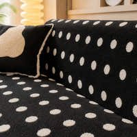 Close view of the midnight dot teddy sofa cover backrest and raised cream dots