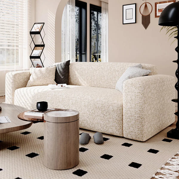 Sand gold teddy sofa cover styled in a boho living room with a grey throw and side table