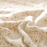 Macro close-up of the sand gold teddy texture, cream sherpa with golden marbled threads