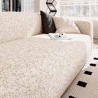 Sand gold teddy sofa cover styled with a dark grey cushion and a coffee tray by the window