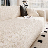 Sand gold teddy sofa cover styled with a dark grey cushion and a coffee tray by the window