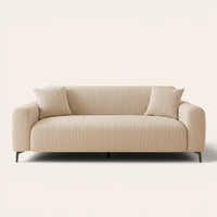 Almond cream waffle sofa cover fitted on a three-seat sofa, front view on ivory backdrop