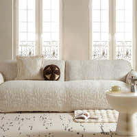 Ivory cream woven sofa cover styled in a bright living room with matching cushions and coffee