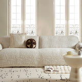 Ivory cream woven sofa cover styled in a bright living room with matching cushions and coffee