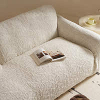 Close view of the ivory cream woven sofa cover texture across the seat and backrest