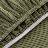 Detail of the elasticated hem and stitched edge on the underside of an olive green corduroy cover