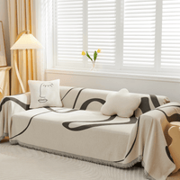 Abstract Haze Abstract Muse throw over a corner sofa with face and star cushions