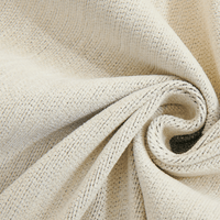 Macro swirl of the woven Monochrome Wave fabric showing its soft cream texture