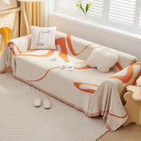 Sunset Stream Abstract Muse throw over a corner sofa with face and cloud cushions
