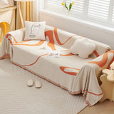 Sunset Stream Abstract Muse throw over a corner sofa with face and cloud cushions