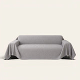 Graphite mist Artisan Cooling sofa throw in soft gray with an embossed geometric texture, front view on ivory