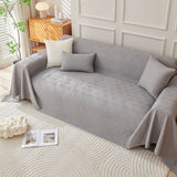 Graphite mist Artisan Cooling throw covering a sofa with matching cushions in a serene living room