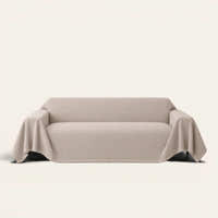 Shell Taupe Artisan Cooling sofa throw draped over a full couch, front view on ivory background