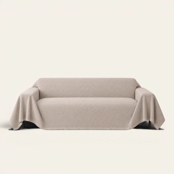 Shell Taupe Artisan Cooling sofa throw draped over a full couch, front view on ivory background
