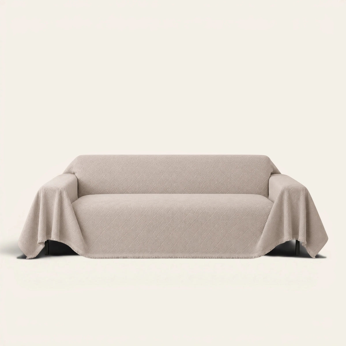 Shell Taupe Artisan Cooling sofa throw draped over a full couch, front view on ivory background