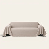 Shell Taupe Artisan Cooling sofa throw draped over a full couch, front view on ivory background
