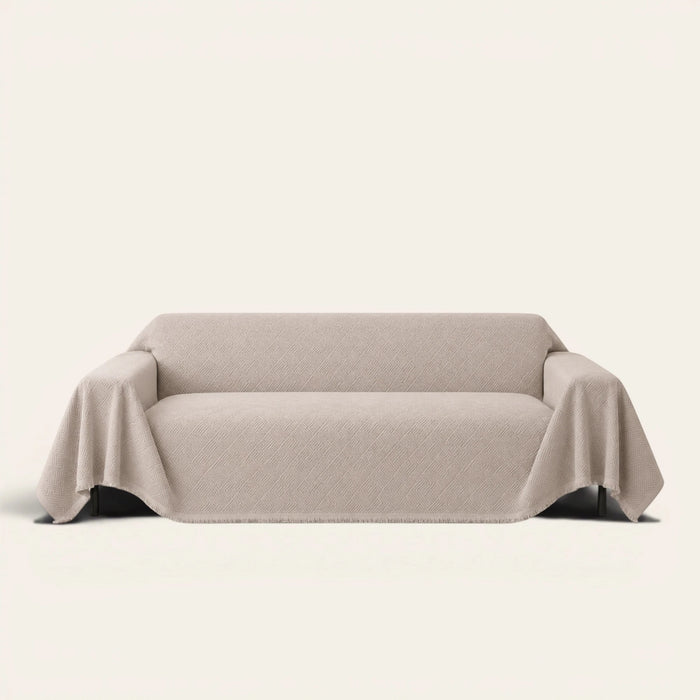 Shell Taupe Artisan Cooling sofa throw draped over a full couch, front view on ivory background