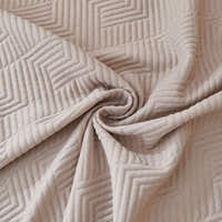 Macro swirl of the Shell Taupe Artisan Cooling fabric showing quilted geometric stitching