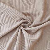 Macro swirl of the Shell Taupe Artisan Cooling fabric showing quilted geometric stitching