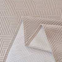 Flat detail of the Shell Taupe Artisan Cooling throw, folded corner revealing the woven reverse side