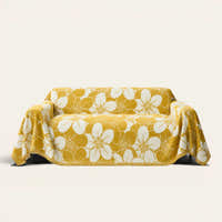 Golden bloom Bloom Elegance sofa throw in mustard yellow with a white floral print, front view on ivory