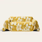 Golden bloom Bloom Elegance sofa throw in mustard yellow with a white floral print, front view on ivory