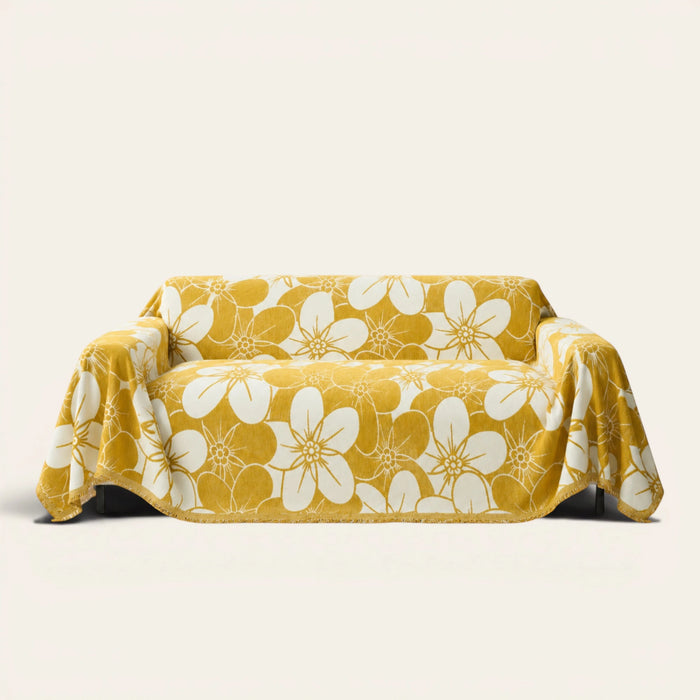 Golden bloom Bloom Elegance sofa throw in mustard yellow with a white floral print, front view on ivory