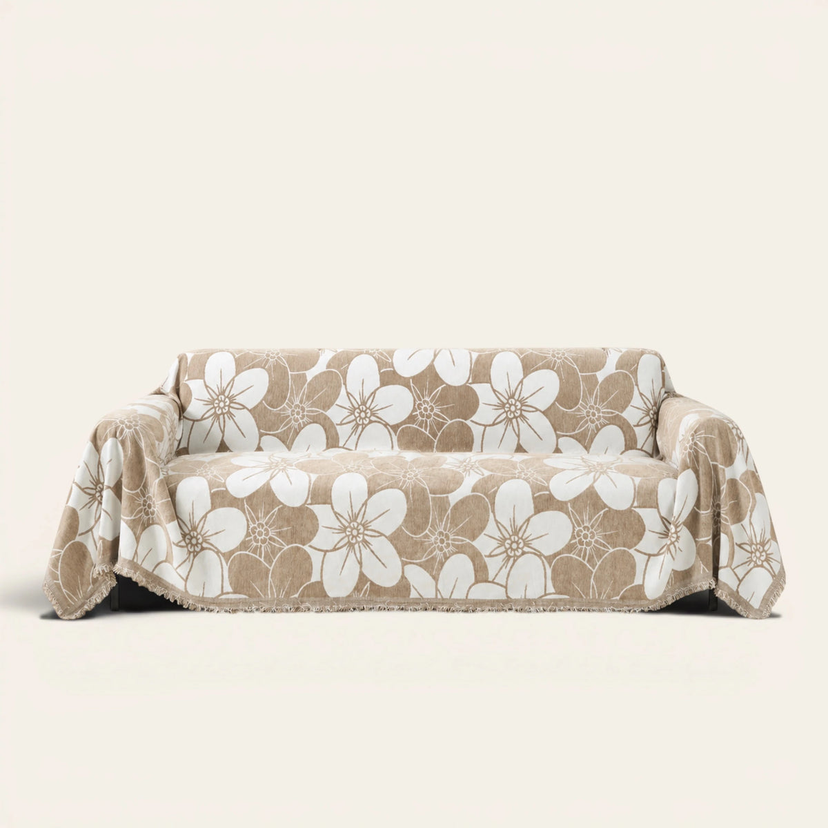 Mocha Latte Bloom Elegance sofa throw draped over a two-seat sofa, front view on ivory background, large white floral pattern
