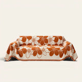 Rustic Blossom Bloom Elegance floral throw draped over a two-seat sofa on ivory background