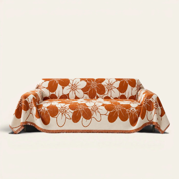 Rustic Blossom Bloom Elegance floral throw draped over a two-seat sofa on ivory background