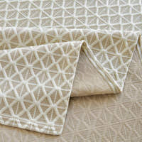 Macro of the woven Ivory Pearl fabric showing the Breeze Lattice diamond weave and border